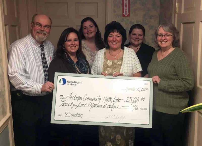 Skowhegan team presenting a check to Jackman Community Health Center